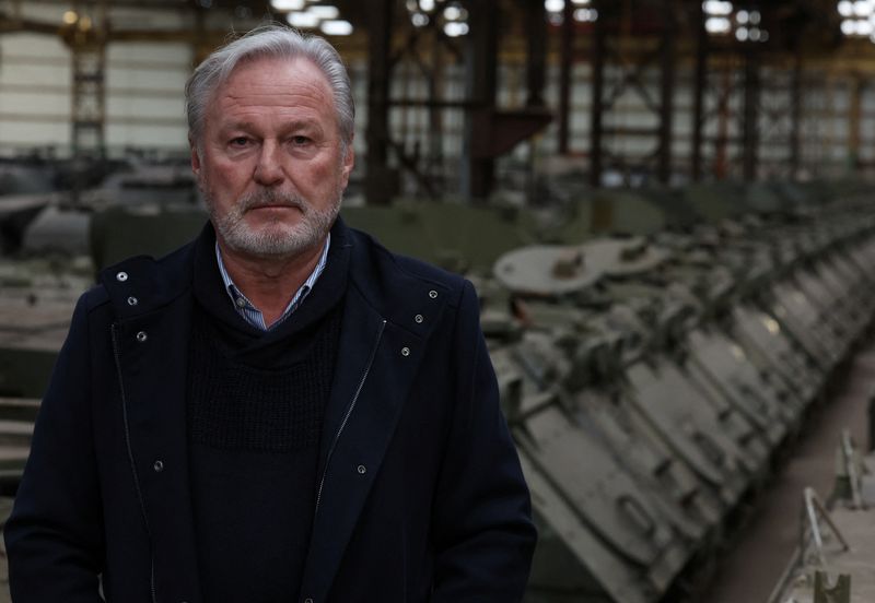 &copy; Reuters. Freddy Versluys, the CEO of Belgian defence company OIP Land Systems, who said could help Ukraine if he received export permits from the Belgian regional government of Wallonia and from Germany to sell is tanks, looks on near armoured vehicles, in a hanga
