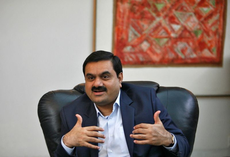 © Reuters. FILE PHOTO: Indian billionaire Gautam Adani speaks during an interview in the western Indian city of Ahmedabad September 24, 2012.REUTERS/Amit Dave/File Photo