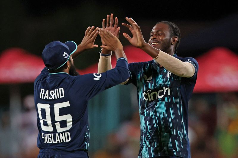 &copy; Reuters. Cricket - Third One Day International - South Africa v England - De Beers Diamond Oval, Kimberley, South Africa - February 1, 2023 England's Jofra Archer celebrates after the match with Adil Rashid REUTERS/Rogan Ward