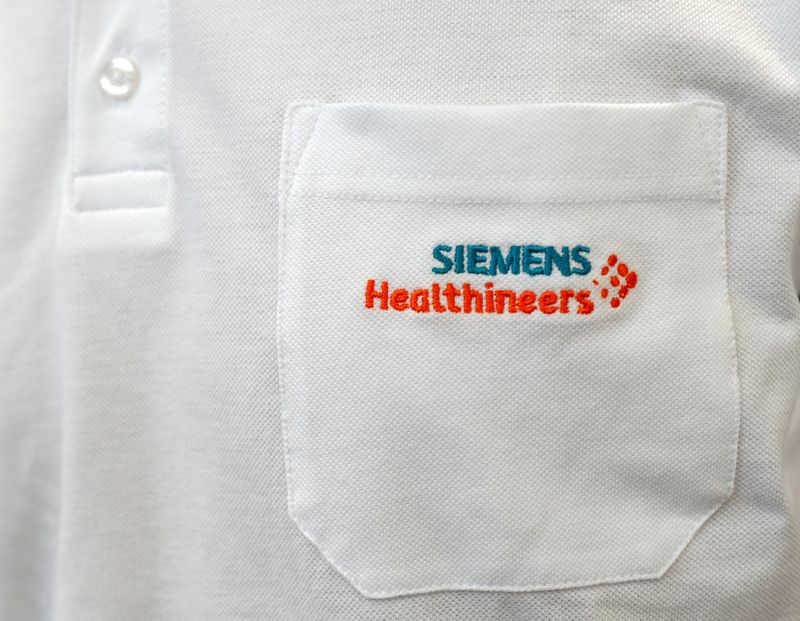 &copy; Reuters. FILE PHOTO: Siemens Healthineers logo is seen on an item of clothing in manufacturing plant in Forchheim near Nuremberg, Germany, October 7, 2016. REUTERS/Michaela Rehle/File Photo