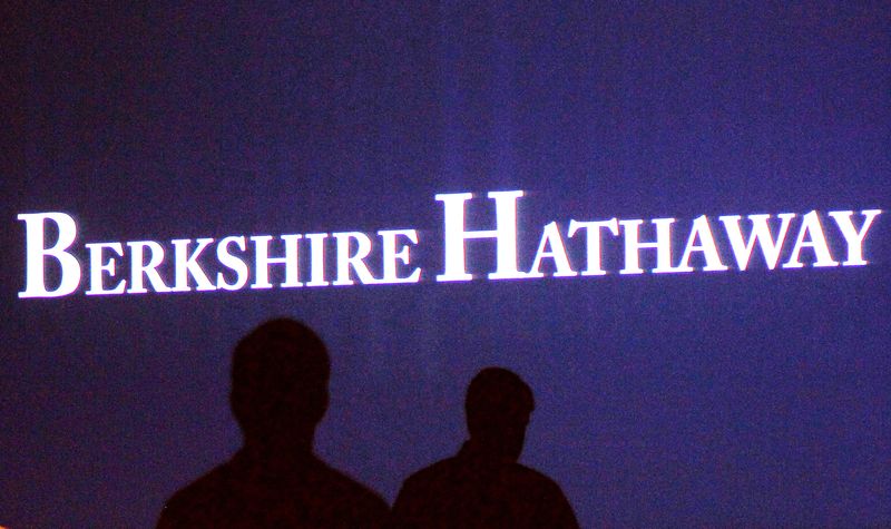 &copy; Reuters. FILE PHOTO: Berkshire Hathaway shareholders walk by a video screen at the company's annual meeting in Omaha May 4, 2013.  REUTERS/Rick Wilking/File Photo