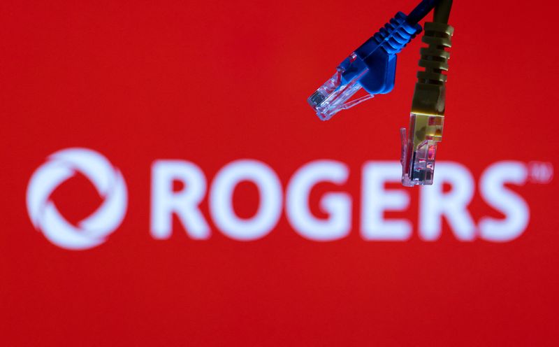 &copy; Reuters. FILE PHOTO: Ethernet cables are seen in front of Rogers Communications logo in this illustration taken, July 8, 2022. REUTERS/Dado Ruvic/Illustrations