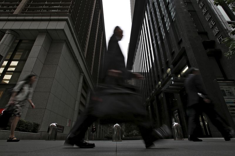 &copy; Reuters. FILE PHOTO: A man walks on a street at a business district in Tokyo, June 12, 2015. REUTERS/Yuya Shino