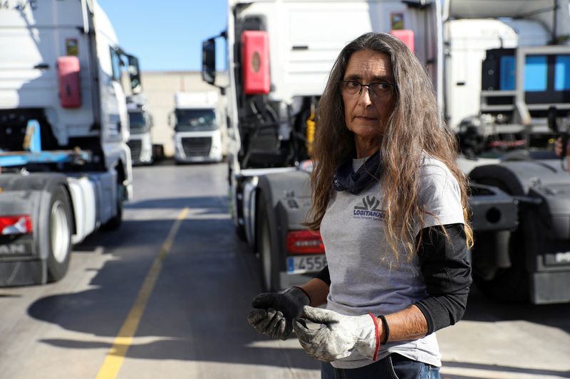 &copy; Reuters. FILE PHOTO: Begona Urmeneta, 59, a female lorry driver for over 26 years, prepares to start a route to Perpignan transporting a tanker with resin, at the base of the trucking company where she works, in Torrent, Spain December 12, 2021.   REUTERS/Eva Mane