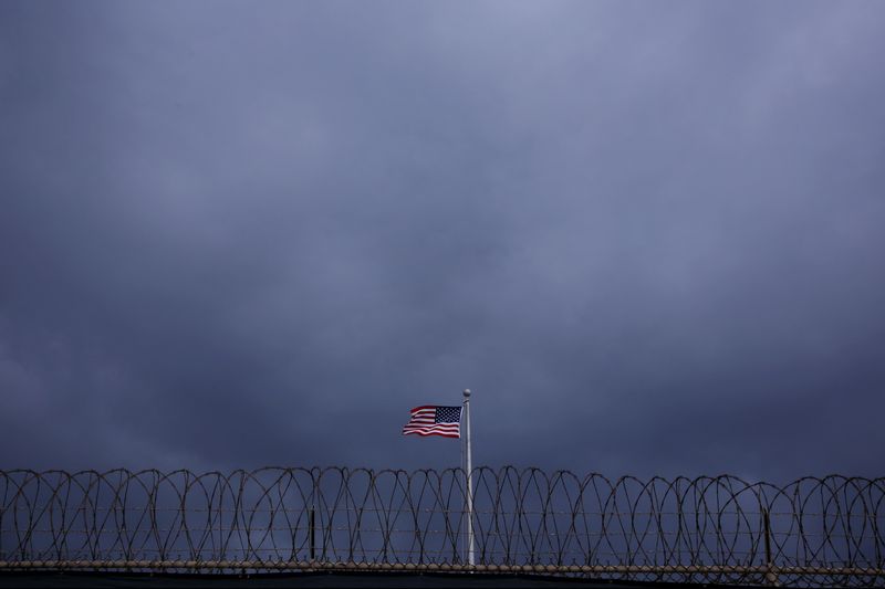 © Reuters. FILE PHOTO: The United States flag flies inside of Joint Task Force Guantanamo Camp VI at the U.S. Naval Base in Guantanamo Bay, Cuba March 22, 2016.  REUTERS/Lucas Jackson