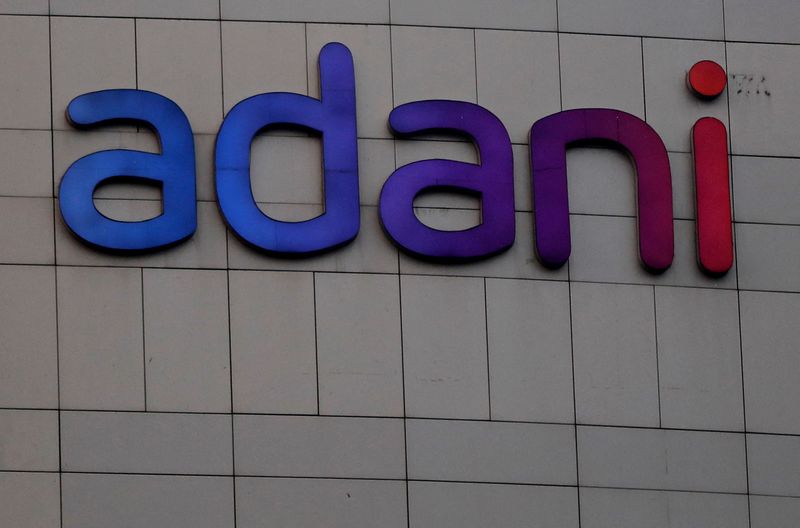 &copy; Reuters. FILE PHOTO-The logo of the Adani Group is seen on the facade of its Corporate House on the outskirts of Ahmedabad, India, January 27, 2023. REUTERS/Amit Dave