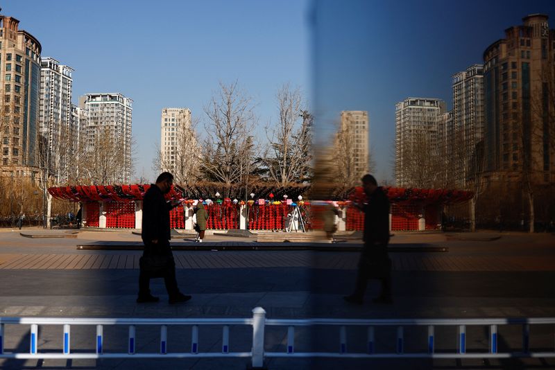 &copy; Reuters. A person walks on a street in Beijing, China February 3, 2023. REUTERS/Tingshu Wang