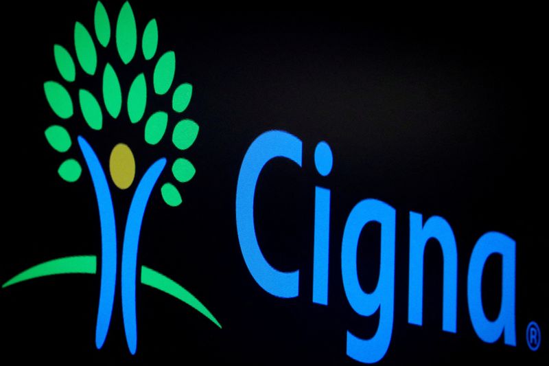 © Reuters. FILE PHOTO: A screen displays the logo for Cigna Corp. on the floor at the New York Stock Exchange (NYSE) in New York, U.S., July 16, 2019. REUTERS/Brendan McDermid/File Photo