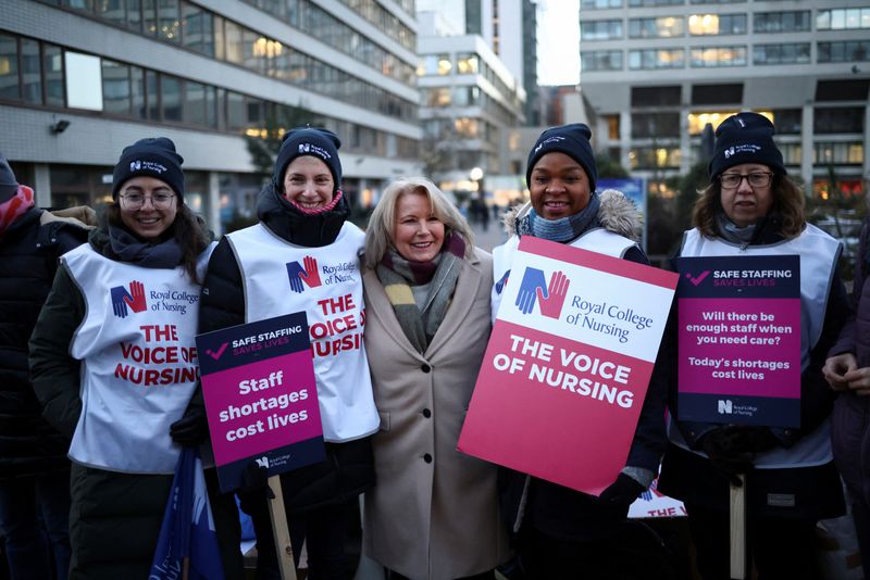 © Reuters. FILE PHOTO: Pat Cullen, head of the Royal College of Nursing union poses with NHS nurses during a strike, due to a dispute with the government over pay, outside St Thomas' Hospital in London, Britain December 15, 2022. REUTERS/Henry Nicholls
