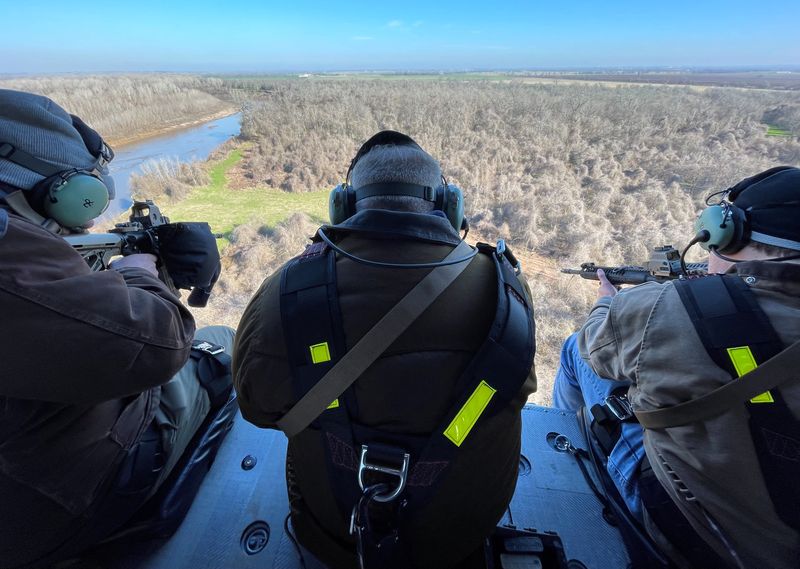 In Texas, hunters shoot feral pigs from helicopters