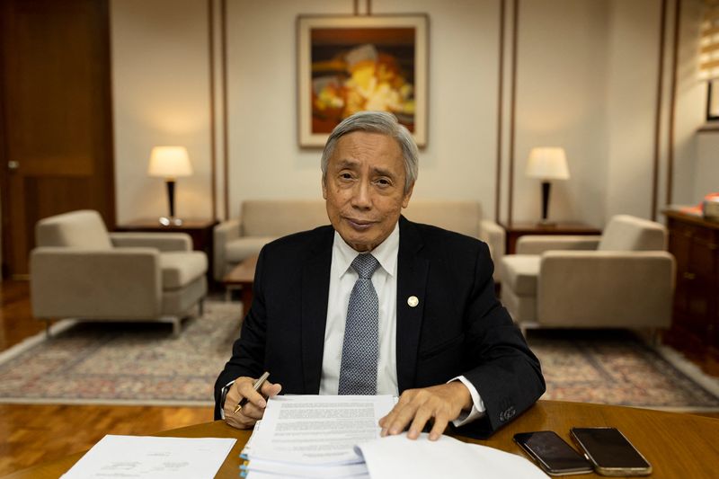 &copy; Reuters. FILE PHOTO-Bangko Sentral ng Pilipinas Governor Felipe Medalla poses for a photograph in his office at Manila, Philippines, November 18, 2022. REUTERS/Eloisa Lopez