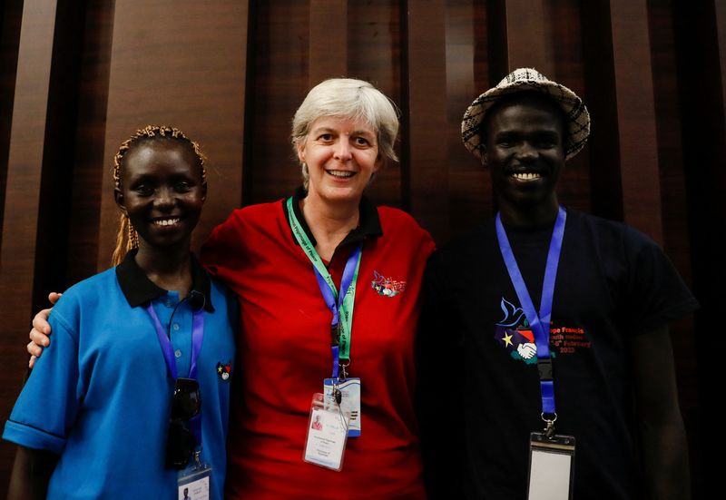 © Reuters. Sister Orla Treacy (centre), Sarah Adut Makender, 19, and John Sebit Malou, 26, pose for a picture on the second day of Pope Francis' apostolic journey, in Juba, South Sudan, February 4, 2023. REUTERS/Yara Nardi