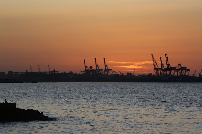 © Reuters. الشمس تغرب على ميناء الدخيلة في صورة من أرشيف رويترز.