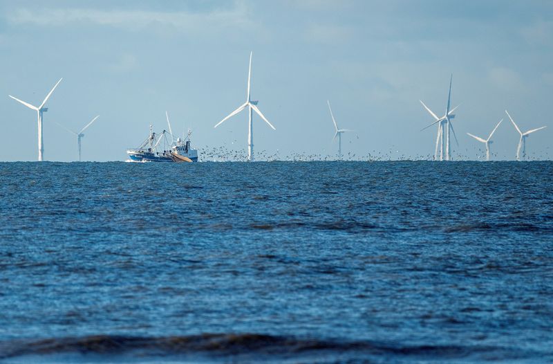 &copy; Reuters. FILE PHOTO: Wind turbines are seen from the Vejers Strand beach, Jutland, Denmark, December 26, 2021. John Randeris/Ritzau Scanpix/via REUTERS     