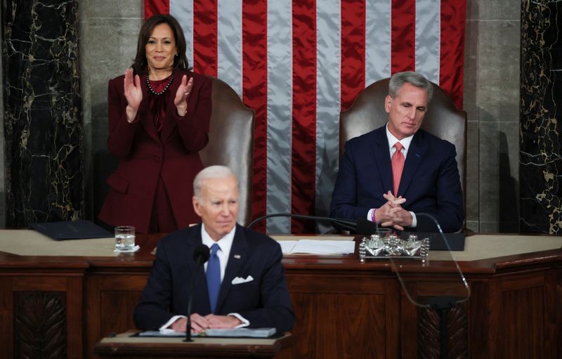 &copy; Reuters. U.S. Vice President Kamala Harris stands and applauds while Speaker of the House Kevin McCarthy remains seated after President Joe Biden said "The state of the union is strong" while delivering his State of the Union address before a joint session of Cong