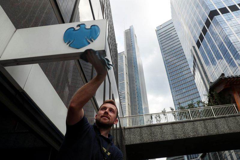 &copy; Reuters. FILE PHOTO: A worker cleans a Barclays logo outside a bank branch in the financial district of London, Britain July 8, 2019. REUTERS/Simon Dawson/