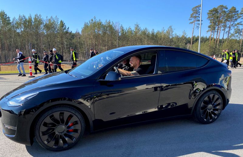 &copy; Reuters. FILE PHOTO: A customer drives his new Model Y after a ceremony inside the new Tesla Gigafactory for electric cars in Gruenheide, Germany, March 22, 2022. REUTERS/Nadine Schimroszik/File Photo