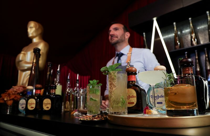 &copy; Reuters. FILE PHOTO: A bartender stands behind a counter with prepared drinks placed on it during a preview of the food, beverages and decor of this year?s Governors Ball, the Academy?s official post-Oscars celebration following the 94th Oscars ceremony in Los Ang
