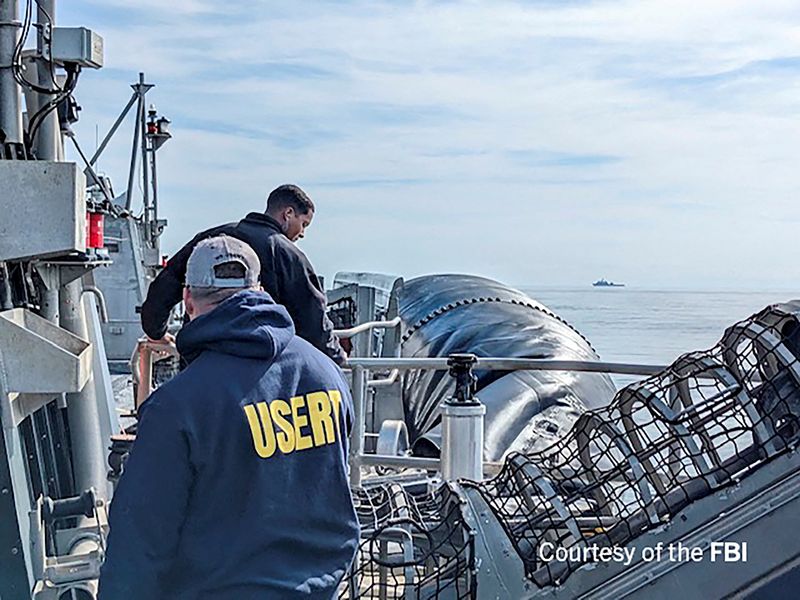 &copy; Reuters. An undated U.S. Federal Bureau of Investigation handout photo taken aboard the USS Carter Hull off South Carolina shows FBI Special Agents assigned to the bureau’s Evidence Response Team ready to process material recovered from the high-altitude Chinese