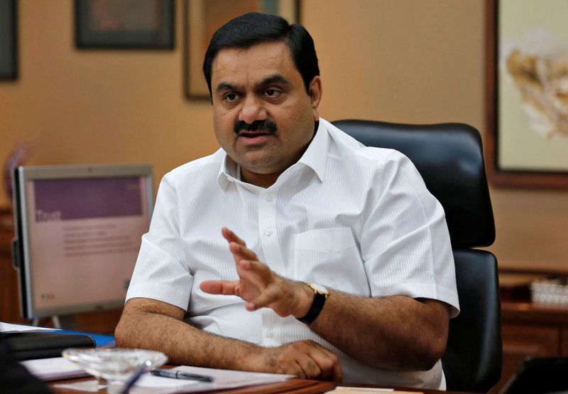 © Reuters. FILE PHOTO: Indian billionaire Gautam Adani speaks during an interview with Reuters at his office in the western Indian city of Ahmedabad April 2, 2014.   REUTERS/Amit Dave