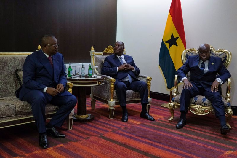 &copy; Reuters. FILE PHOTO: Guinea-Bissau's President General Umaro Sissoco Embalo, Ivory Coast's President Alassane Ouattara and Ghana's President Nana Akufo Addo attend the ECOWAS summit to discuss transitional roadmap for Mali, Burkina Faso and Guinea, in Accra, Ghana