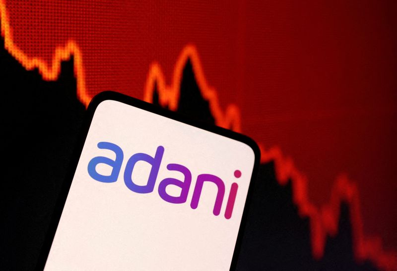&copy; Reuters. FILE PHOTO: Adani logo and decreasing stock graph is seen in this illustration taken January 31, 2023. REUTERS/Dado Ruvic/Illustration