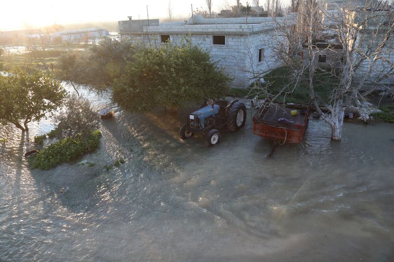 &copy; Reuters. FILE PHOTO: Village of Al-Tloul is flooded as a result of a Syrian dam being opened fearing aftershocks damaging the dam according to the Syrian Observatory of Human Rights, in Idlib region, Syria February 9, 2023 in this picture obtained from social medi