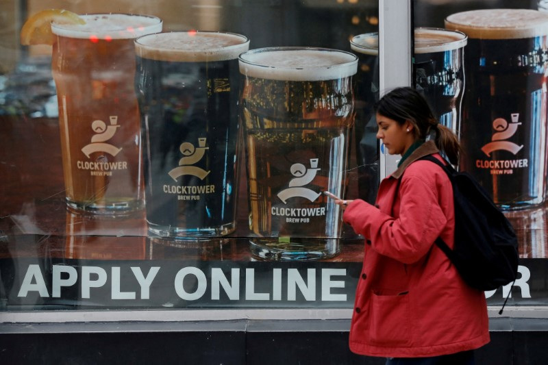 &copy; Reuters. FILE PHOTO: A sign advertising available jobs at the Clocktower Brew Pub hangs in a window in Ottawa, Ontario, Canada, November 9, 2017. REUTERS/Chris Wattie/File Photo