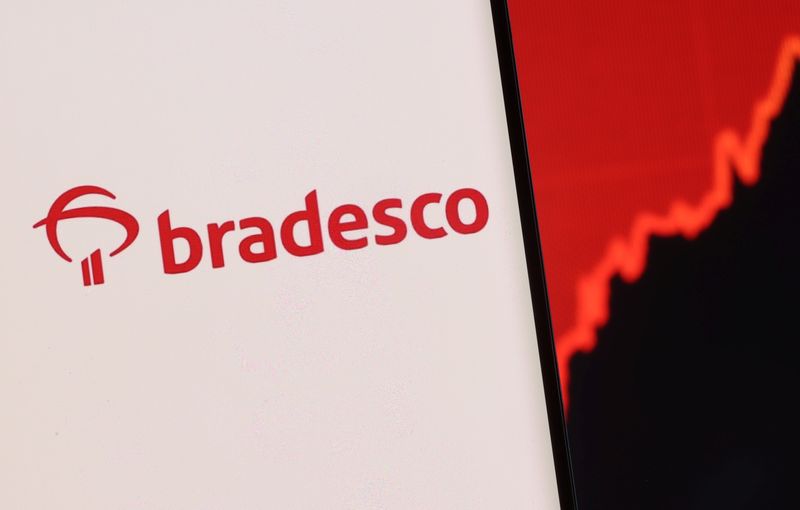 &copy; Reuters. FILE PHOTO: Banco Bradesco logo is seen on a smartphone in front of displayed stock graph in this illustration taken, December 1, 2021. REUTERS/Dado Ruvic/Illustration
