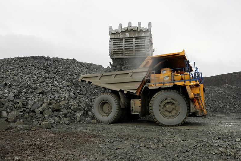 © Reuters. FILE PHOTO: A dump truck is loaded with ore at Zapolyarny mine of Medvezhy Ruchey enterprise, which is a subsidiary of the world's leading nickel and palladium producer Nornickel, in the Arctic city of Norilsk, Russia August 24, 2021.  REUTERS/Tatyana Makeyeva