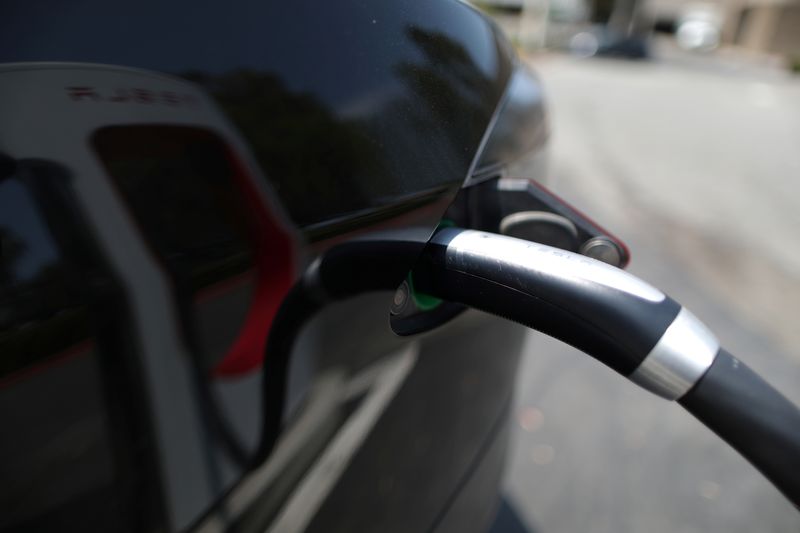 Exclusive-To tap U.S. government billions, Tesla must unlock EV chargers 
