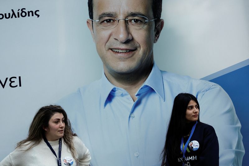 &copy; Reuters. Supporters of Cyprus presidential candidate Nikos Christodoulides are seen in front of a poster, at the campaign headquarters a day ahead of the presidential elections, in Nicosia, Cyprus, February 11, 2023. REUTERS/Louiza Vradi