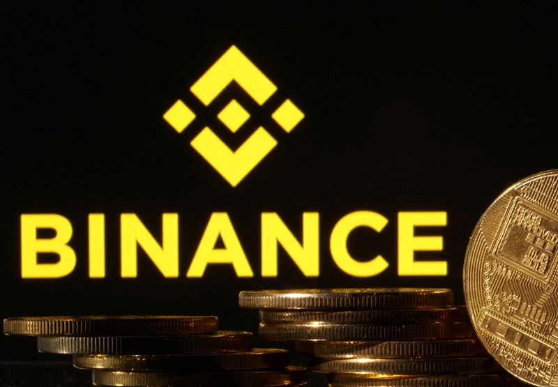 © Reuters. FILE PHOTO: Representations of cryptocurrencies are seen in front of displayed Binance logo in this illustration taken November 10, 2022. REUTERS/Dado Ruvic/Illustration