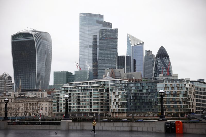 &copy; Reuters. FILE PHOTO: A person jogs, with financial district in the background, in London, Britain, January 5, 2021. REUTERS/Henry Nicholls/File Photo