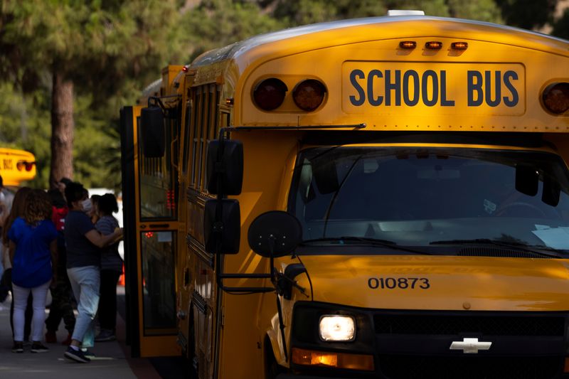 © Reuters. FILE PHOTO: School buses line up outside Woodrow Wilson Senior High School as students return to in-person classes in Los Angeles, California, U.S., August 30, 2021.  REUTERS/Mike Blake