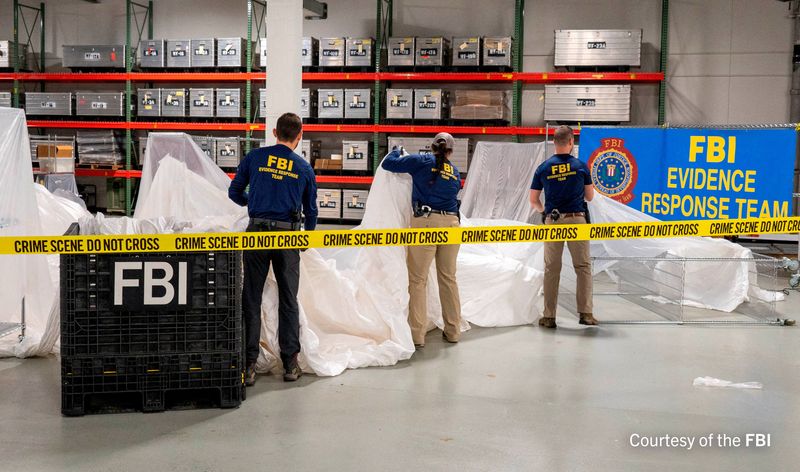 © Reuters. FILE PHOTO: An undated U.S. Federal Bureau of Investigation handout photo taken at an undisclosed location shows FBI Special Agents assigned to the bureau’s Evidence Response Team processing material recovered from the high-altitude Chinese balloon that was shot down by a U.S. military jet off the coast of South Carolina, in this image released by the FBI on February 9, 2023.  FBI/Handout via Reuters 
