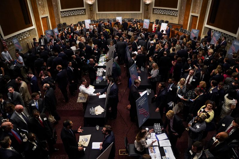 &copy; Reuters. FILE PHOTO: People attend the Executive Branch Job Fair hosted by the Conservative Partnership Institute at the Dirksen Senate Office Building in Washington, U.S., June 15, 2018. REUTERS/Toya Sarno Jordan