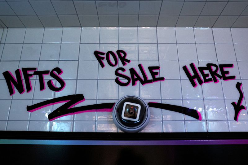 &copy; Reuters. FILE PHOTO: A sign saying "NFT FOR SALE HERE," is seen in a small storefront that hosts digital art collecting platform Neon?s first in-person non-fungible token (NFT) vending machine in Lower Manhattan's financial district of New York City, U.S., March 1