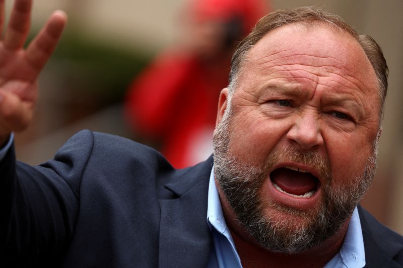 &copy; Reuters. FILE PHOTO: Infowars founder Alex Jones speaks to the media after appearing at his Sandy Hook defamation trial at Connecticut Superior Court in Waterbury, Connecticut, U.S., October 4, 2022. REUTERS/Mike Segar