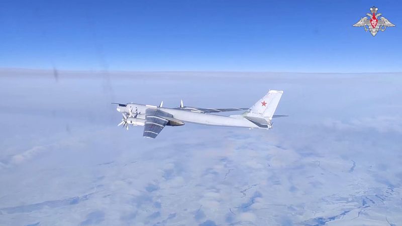 &copy; Reuters. A Russian Tu-95MS strategic bomber performs a flight over the neutral waters of the Bering Sea, in this still image taken from a handout video released February 14, 2023. Russian Defence Ministry/Handout via REUTERS