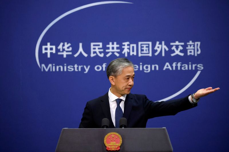 © Reuters. FILE PHOTO: Chinese Foreign Ministry spokesman Wang Wenbin attends a news conference in Beijing, China December 14, 2020. REUTERS/Thomas Peter