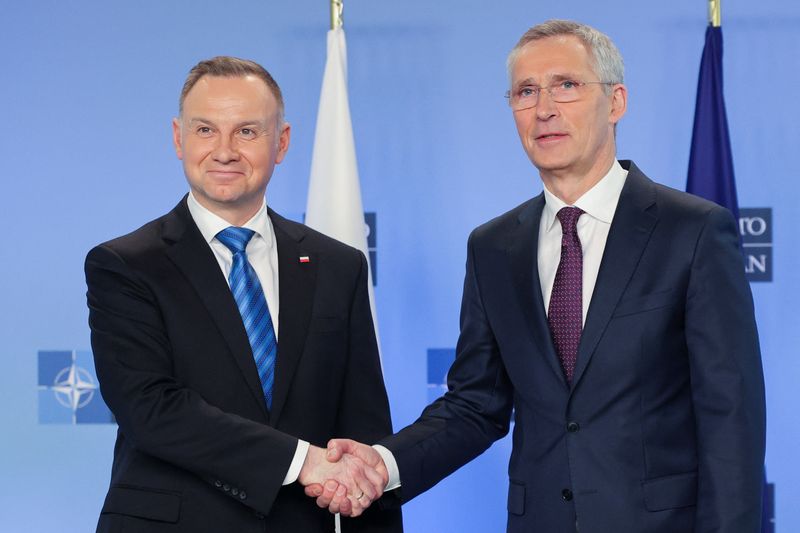 &copy; Reuters. Poland’s President Andrzej Duda is greeted by NATO Secretary General Jens Stoltenberg as they meet on the sidelines of a NATO defense ministers meeting at NATO headquarters in Brussels, Wednesday, Feb. 15, 2023. Olivier Matthys/Pool via REUTERS
