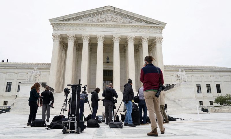 &copy; Reuters. FILE PHOTO: News media gather outside the front of the U.S. Supreme Court building prior to a photo opportunity that will follow the official investiture ceremony for the court's newest Associate Justice Ketanji Brown Jackson prior to the start of the cou