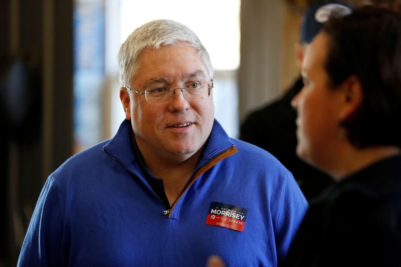 &copy; Reuters. FILE PHOTO: Republican senate nominee Patrick Morrisey speaks with a supporter at a blacksmith's forge ahead of the 2018 midterm elections in Falling Water, West Virginia, U.S., November 4, 2018.      REUTERS/Joshua Roberts