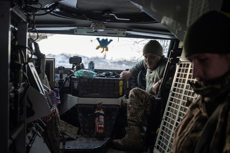 Ukrainian troops holding Bakhmut line demand weapons as world powers meet