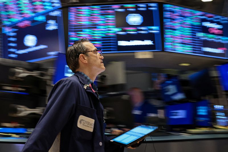 © Reuters. FILE PHOTO: A trader works on the floor of the New York Stock Exchange (NYSE) in New York City, U.S., February 17, 2023.  REUTERS/Brendan McDermid