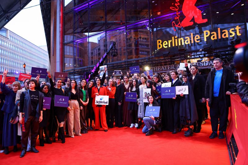 &copy; Reuters. Berlinale Director Mariette Rissenbeek and actor Kristen Stewart together with Iranian filmmakers and further members of the film community demonstrate in solidarity with the protesters in Iran on the Red Carpet at the 73rd Berlinale International Film Fe