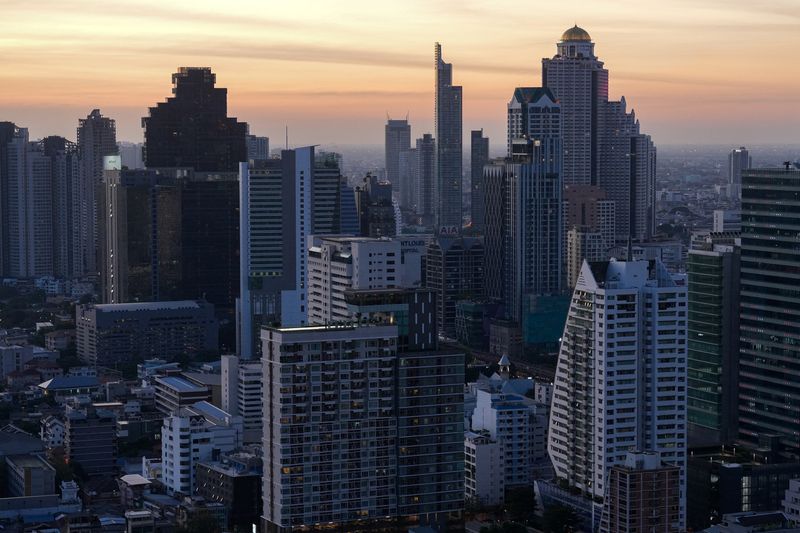 &copy; Reuters. FILE PHOTO: Skyscrapers are photographed against the setting sun in Bangkok, Thailand, January 4, 2023. REUTERS/Athit Perawongmetha