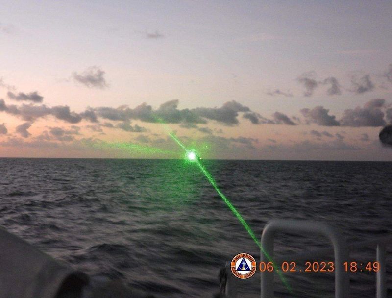 &copy; Reuters. FILE PHOTO: A green light appears from the direction of a Chinese coast guard ship at the Second Thomas Shoal, 105 nautical miles off the Palawan Province, Philippines, February 6, 2023 in this handout image. Philippine Coast Guard/Handout via REUTERS 