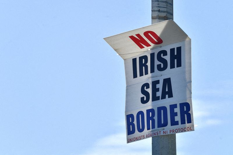 &copy; Reuters. FILE PHOTO: A poster reading "No Irish Sea border" is seen in the port of Larne, Northern Ireland, June 20, 2022. REUTERS/Clodagh Kilcoyne//File Photo